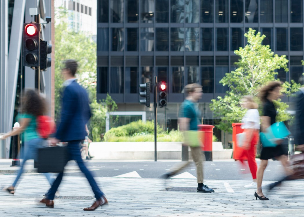 Busy commuters walking on crowded street