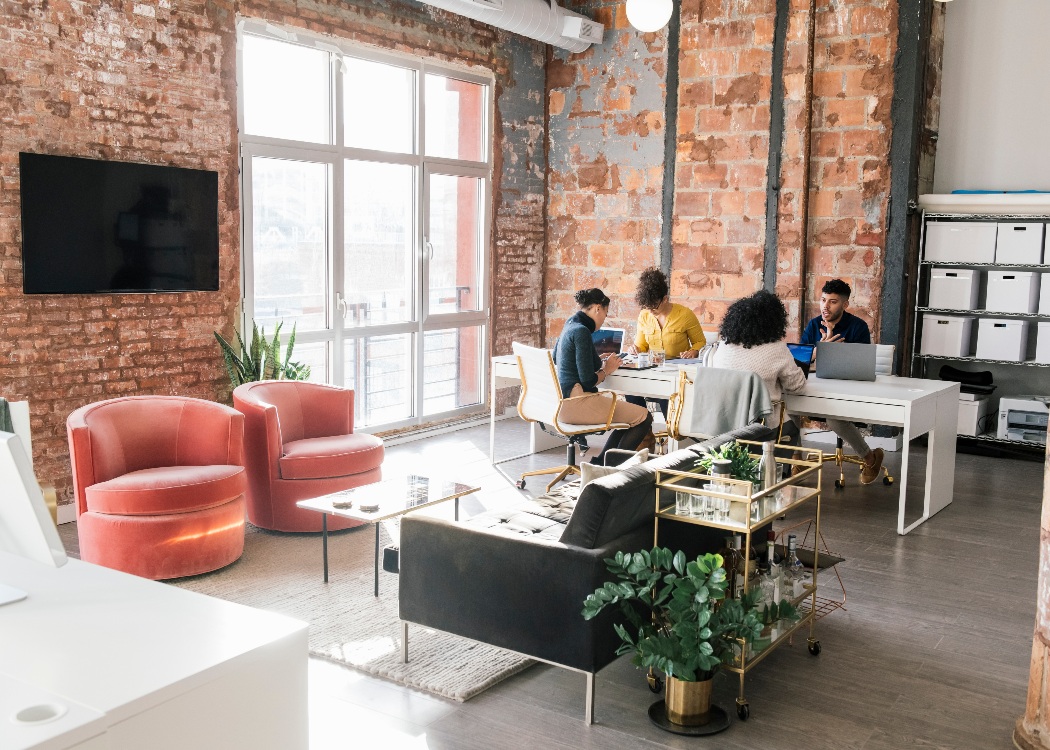 Business people having a meeting in a hybrid office