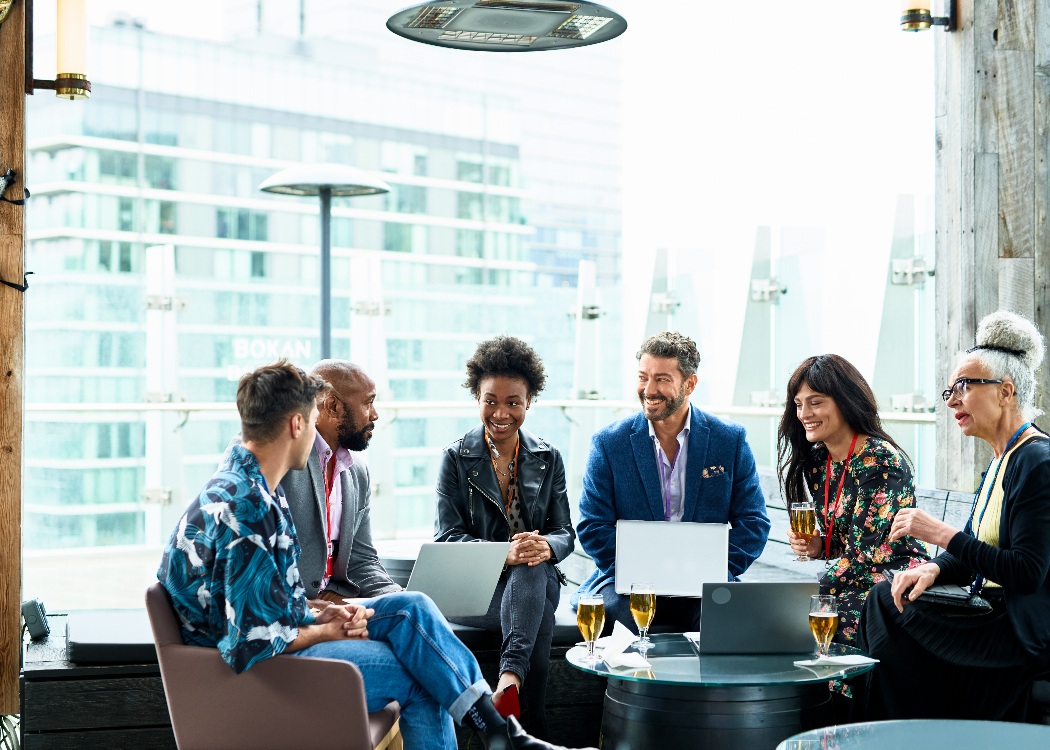Co-workers relaxing with drinks