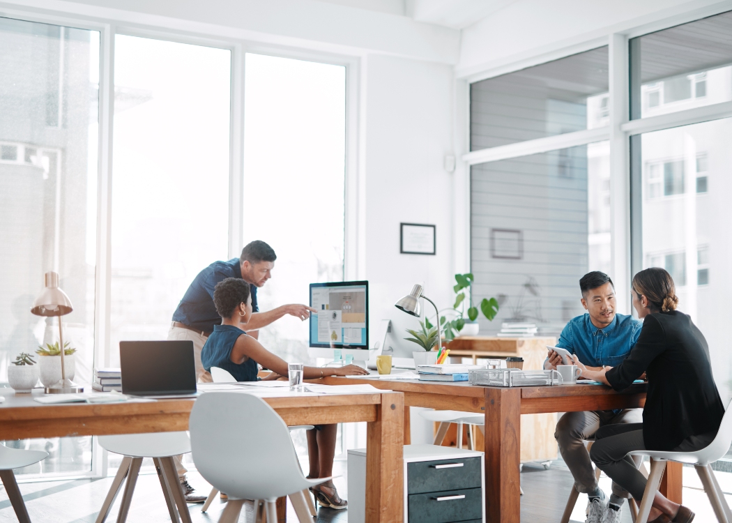 Office workers collaborating at their desks