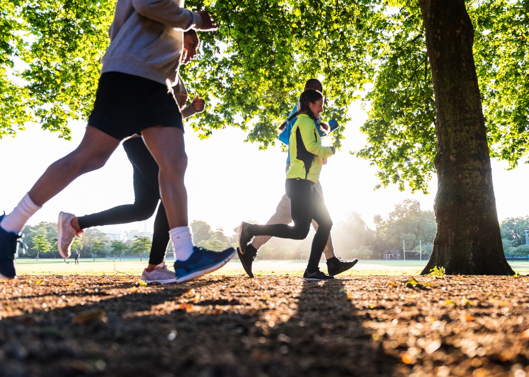 colleagues on a park run in the sun