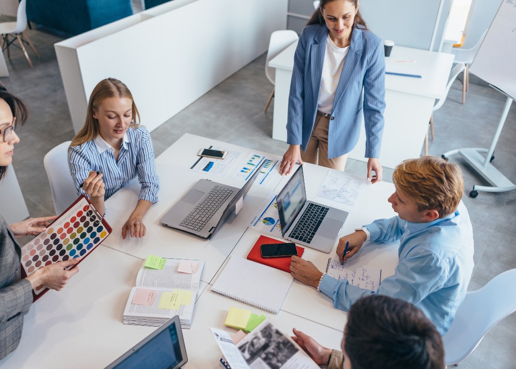 Employees consulting and working on project